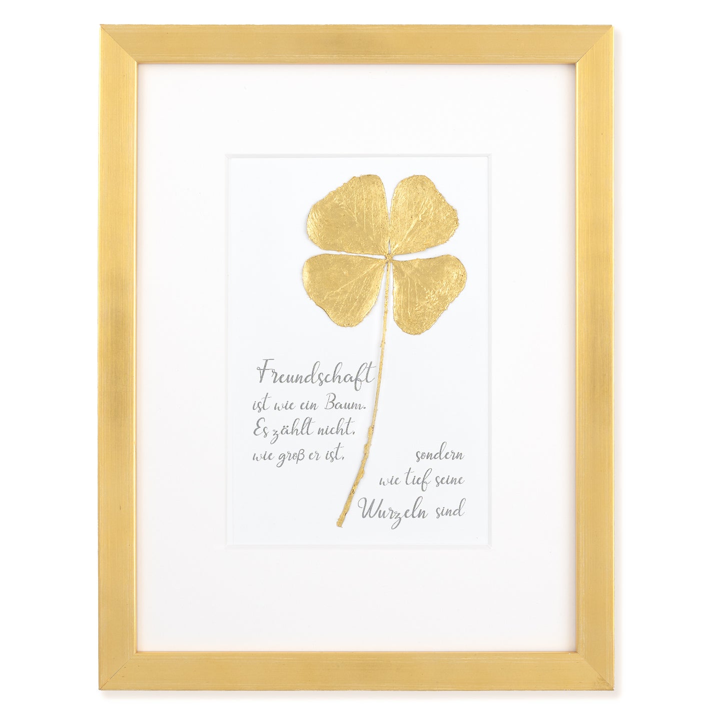 Goldenes Glück - Vergoldetes Vierblättriges Kleeblatt mit Spruch. Freundschaft ist wie ein Baum. Es zählt nicht, wie groß er ist, sondern wie tief seine Wurzeln sind. Poetisches Spruchbild mit Massivholzrahmen.