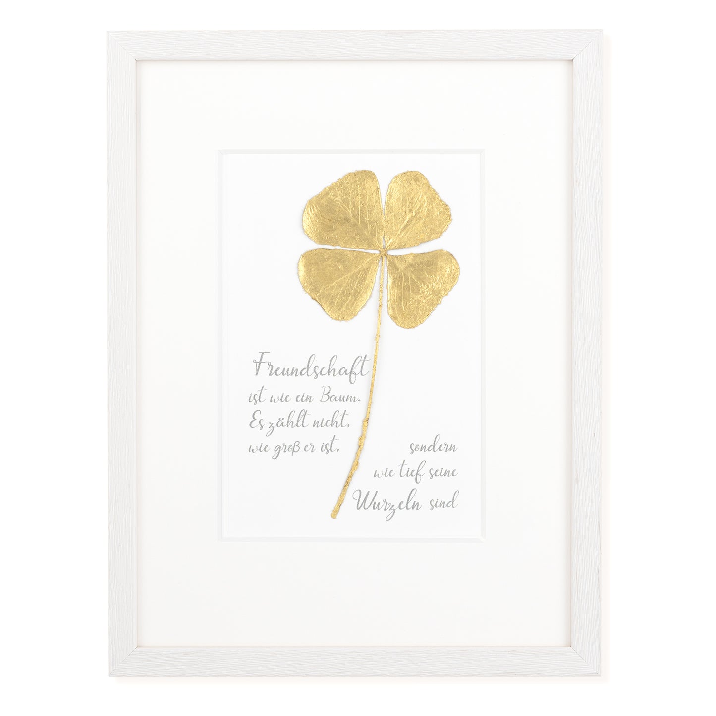 Goldenes Glück - Vergoldetes Vierblättriges Kleeblatt mit Spruch. Freundschaft ist wie ein Baum. Es zählt nicht, wie groß er ist, sondern wie tief seine Wurzeln sind. Poetisches Spruchbild mit Massivholzrahmen.