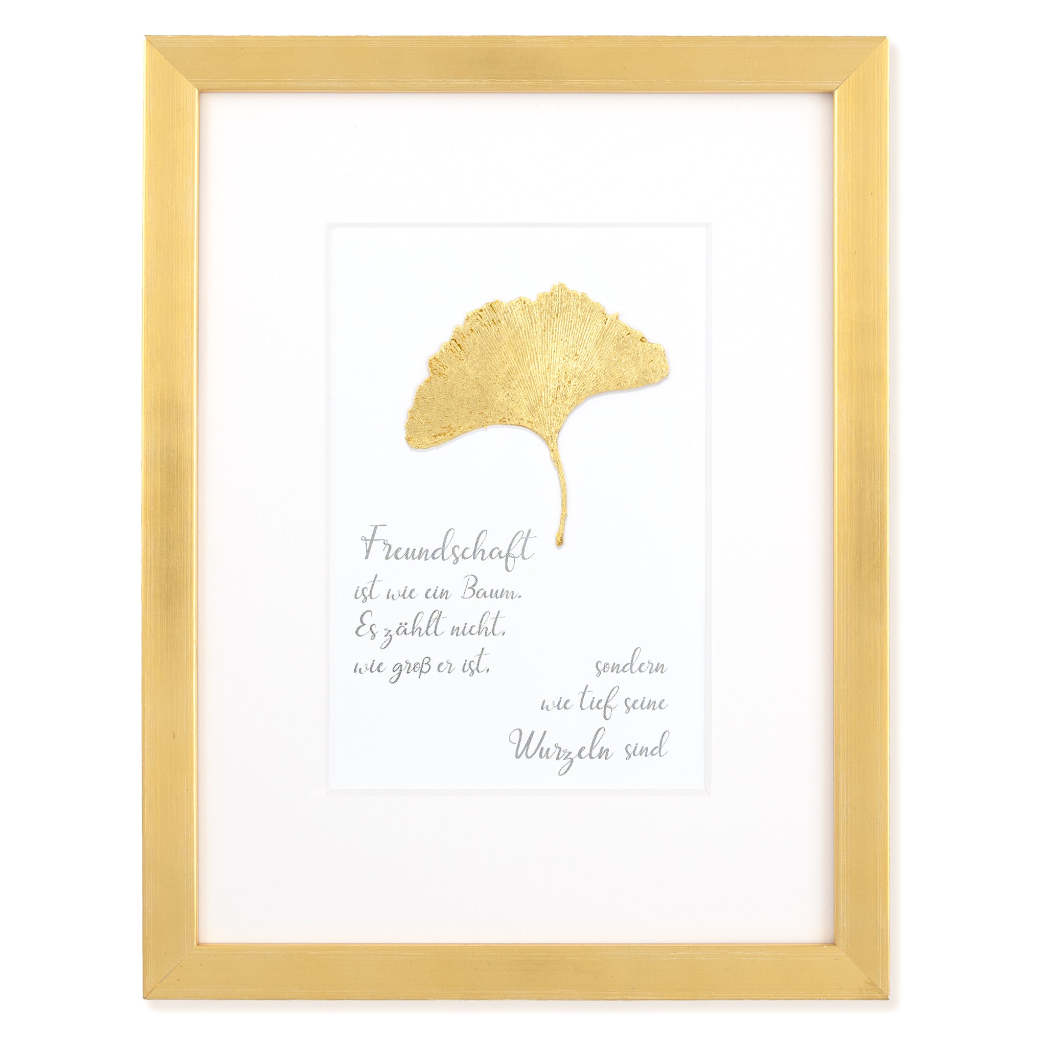 Goldenes Glück - Vergoldetes Ginkgoblatt mit Spruch, Freundschaft ist wie ein Baum. Es zählt nicht wie groß er ist, sondern wie tief seine Wurzeln sind. Poetisches Spruchbild mit Massivholzrahmen.